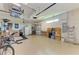 Spacious garage featuring ample storage space, work area, and room for multiple vehicles and bikes at 5035 Tobermory Way, Bradenton, FL 34211
