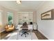 Bright home office with custom built-ins and large window that let in an abundance of natural light at 5035 Tobermory Way, Bradenton, FL 34211