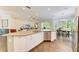 Spacious kitchen boasts a large island, stainless steel appliances, and an adjacent dining area at 5035 Tobermory Way, Bradenton, FL 34211