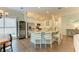 Bright, modern kitchen featuring a large island, stainless steel appliances, and a wine refrigerator at 5035 Tobermory Way, Bradenton, FL 34211