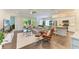 Spacious open-plan living room seamlessly connects to the kitchen and dining areas, perfect for entertaining at 5035 Tobermory Way, Bradenton, FL 34211