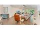 Bright living room with hardwood floors, neutral paint, and sliding glass doors to patio at 5035 Tobermory Way, Bradenton, FL 34211