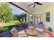 Inviting screened patio featuring comfortable seating and scenic backyard views at 5035 Tobermory Way, Bradenton, FL 34211