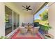 Relaxing screened patio with ceiling fan, stylish furniture and a lovely view at 5035 Tobermory Way, Bradenton, FL 34211