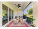 Inviting outdoor patio with comfortable seating, string lights, and serene backyard views at 5035 Tobermory Way, Bradenton, FL 34211