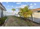 Backyard featuring well kept plants, privacy fence, and manicured rock gardens at 505 47Th Avenue W Dr, Bradenton, FL 34207