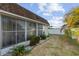 Backyard featuring well kept plants, privacy fence, and manicured white rock gardens at 505 47Th Avenue W Dr, Bradenton, FL 34207