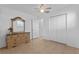 Neutral bedroom with a dresser, ceiling fan, and double closet at 505 47Th Avenue W Dr, Bradenton, FL 34207