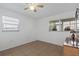 Bright bedroom featuring tile flooring, white walls and ceiling fan at 505 47Th Avenue W Dr, Bradenton, FL 34207
