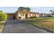 Charming single-story home with carport and well-maintained landscaping at 505 47Th Avenue W Dr, Bradenton, FL 34207