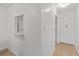 Clean and bright hallway leading to the front door and kitchen at 505 47Th Avenue W Dr, Bradenton, FL 34207