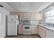 Practical kitchen featuring ample cabinetry and essential appliances at 505 47Th Avenue W Dr, Bradenton, FL 34207