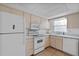 Functional kitchen with refrigerator, range, microwave, and dishwasher at 505 47Th Avenue W Dr, Bradenton, FL 34207