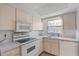 Efficient kitchen layout with electric range and bright natural light at 505 47Th Avenue W Dr, Bradenton, FL 34207
