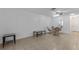 Spacious living room featuring tile floors, ceiling fan and access to the dining area at 505 47Th Avenue W Dr, Bradenton, FL 34207