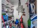 Storage space with paint cans, cleaning supplies, and shelving units at 505 47Th Avenue W Dr, Bradenton, FL 34207