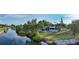 Breathtaking aerial view of a waterfront estate with a pool, lush landscaping, and boat dock along the picturesque canal at 5500 Merrimac Dr, Sarasota, FL 34231