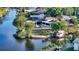 Waterfront property with lush landscaping, boat dock, and private pool at 5500 Merrimac Dr, Sarasota, FL 34231