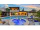 Beautiful backyard featuring a luxurious pool and spa, perfect for relaxation and outdoor gatherings at 5500 Merrimac Dr, Sarasota, FL 34231
