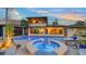 Lovely backyard showcasing a sparkling pool and jacuzzi, ideal for enjoying sunny days and relaxing evenings at 5500 Merrimac Dr, Sarasota, FL 34231