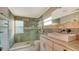 Bathroom featuring a large shower, marble countertop, and vessel sink at 5500 Merrimac Dr, Sarasota, FL 34231