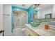Bathroom with a glass bowl sink and tiled shower at 5500 Merrimac Dr, Sarasota, FL 34231