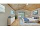 Comfortable bedroom with a unique ceiling design and access to an outdoor patio at 5500 Merrimac Dr, Sarasota, FL 34231