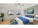 Serene bedroom with nautical decor, a comfortable bed, and bright natural light at 5500 Merrimac Dr, Sarasota, FL 34231