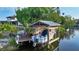 State-of-the-art boat lift and private dock showcasing the property's amazing waterfront access and boating lifestyle at 5500 Merrimac Dr, Sarasota, FL 34231