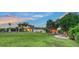 Inviting exterior view highlighting a well-maintained lawn and a delightful backyard retreat, ideal for outdoor relaxation at 5500 Merrimac Dr, Sarasota, FL 34231