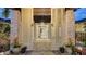 Elegant front entryway featuring stone columns, ornate doors, and decorative lion accents at 5500 Merrimac Dr, Sarasota, FL 34231
