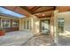 Welcoming front entrance with a tiled walkway, covered portico, and glass-paneled front door at 5500 Merrimac Dr, Sarasota, FL 34231