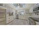 Bright open kitchen with stainless steel appliances and plenty of white marble counter space at 5500 Merrimac Dr, Sarasota, FL 34231