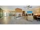 Expansive living room with unique fireplace, entertainment area, and seamless flow to other rooms at 5500 Merrimac Dr, Sarasota, FL 34231