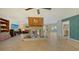 Open-concept living room featuring a statement fireplace and ample natural light at 5500 Merrimac Dr, Sarasota, FL 34231