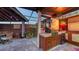 Outdoor kitchen area with grill, bar, and unique stone accents at 5500 Merrimac Dr, Sarasota, FL 34231