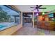 Entertainer's patio boasts a full bar, grill, and screened-in dining area at 5500 Merrimac Dr, Sarasota, FL 34231
