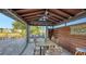 Enclosed patio with a dining set, ceiling fan, and view of the canal at 5500 Merrimac Dr, Sarasota, FL 34231