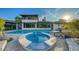 Beautiful pool and spa with a covered outdoor area, ideal for enjoying the outdoors year-round at 5500 Merrimac Dr, Sarasota, FL 34231