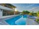 Gorgeous outdoor pool and spa with brick paved patio, perfect for relaxation and entertaining under the sun at 5500 Merrimac Dr, Sarasota, FL 34231