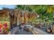 Charming tiki bar with seating, perfect for entertaining guests and enjoying outdoor refreshments by the canal at 5500 Merrimac Dr, Sarasota, FL 34231