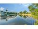 Scenic waterfront homes with lush, tropical landscaping and private docks create an idyllic canal community at 5500 Merrimac Dr, Sarasota, FL 34231