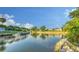 Waterfront view of homes along a canal, lush landscaping and private docks enhance this tropical community at 5500 Merrimac Dr, Sarasota, FL 34231