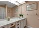 Neutral bathroom with vanity, white cabinets, and tile flooring at 5626 Pipers Waite # 22, Sarasota, FL 34235