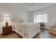 Well-lit bedroom boasts wood floors, a ceiling fan, and a cozy desk at 5626 Pipers Waite # 22, Sarasota, FL 34235