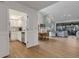 Open-concept living space with vaulted ceilings, seamlessly connecting the kitchen, dining, and living areas at 5626 Pipers Waite # 22, Sarasota, FL 34235