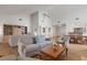 Spacious living room with high ceilings, a ceiling fan, and wood flooring throughout at 5626 Pipers Waite # 22, Sarasota, FL 34235