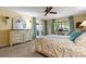 Main bedroom featuring an ensuite and sliding doors leading to a balcony at 5626 Pipers Waite # 22, Sarasota, FL 34235