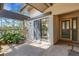 Cozy patio space with a sliding glass door entrance, stone accents, and space for seating at 5626 Pipers Waite # 22, Sarasota, FL 34235