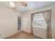 Bedroom featuring a window and a glass paneled exterior door, carpet flooring and neutral paint at 5712 Garden Lakes Dr, Bradenton, FL 34203